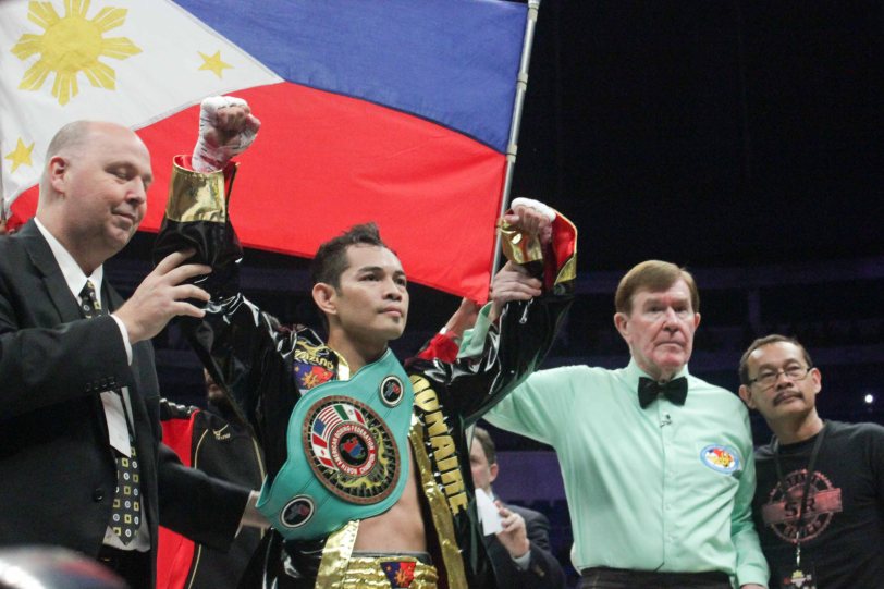 Nonito Donaire Jr raises his hand in victory and earns vacant NABF Super Bantamweight Belt. PINOY PRIDE 30 D-Day was held at the SMART Araneta Coliseum last March 28, 2015. Photo by Jude Bautista