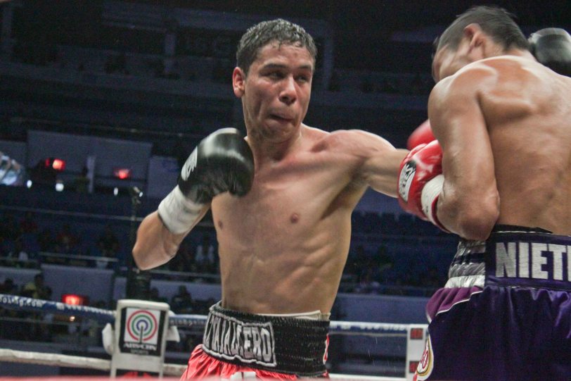 Parra tries to fight back w left jab; PINOY PRIDE 30 D-Day was held at the SMART Araneta Coliseum last March 28, 2015. Photo by Jude Bautista